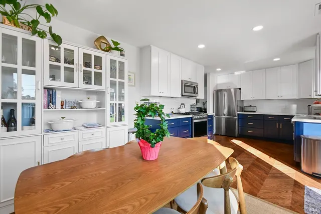 a kitchen with a table and chairs in it