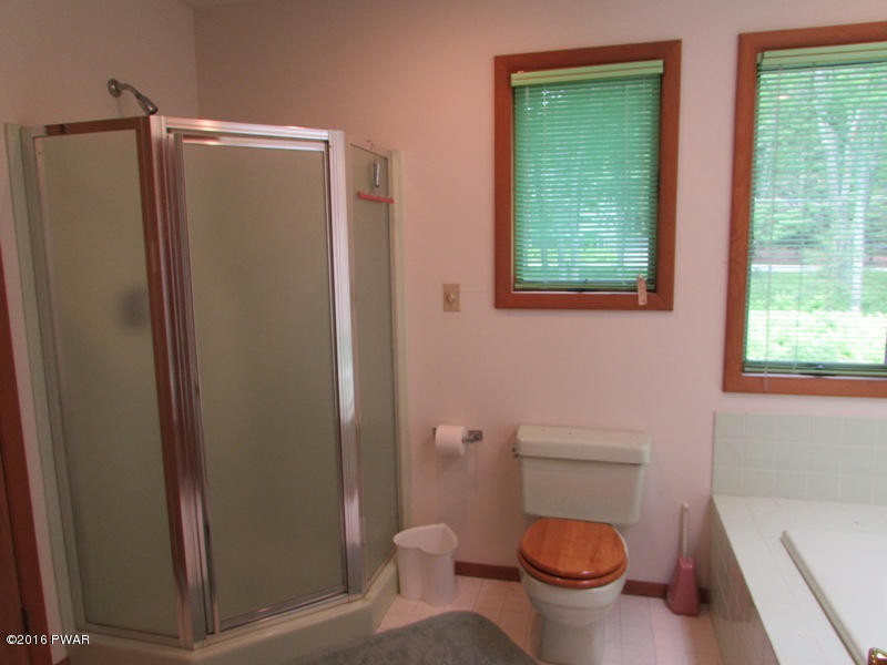 125 Rodeo Lane Hawley, PA 18428 - Photo 19 of 43 a bathroom with a toilet and a shower