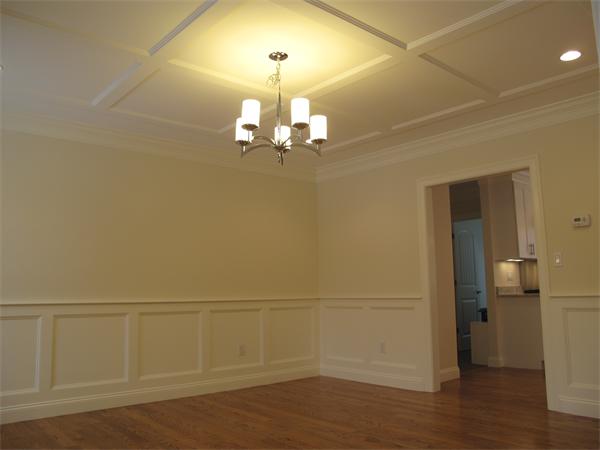 9 Larkin Road Newton, MA 02465 - Photo 3 of 4 wooden floor in an empty room with a chandelier