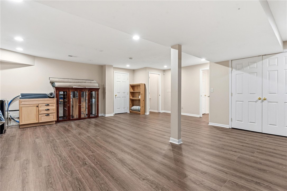 8781 Rupp Farm Drive West Chester, OH 45069 - Photo 38 of 48 An inviting open-plan basement features ample space and durable wood-look flooring.