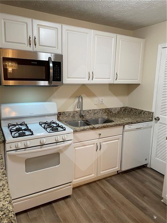 4267 Grogan Street Acworth, GA 30101 - Photo 11 of 37 a white stove top oven sitting inside of a kitchen