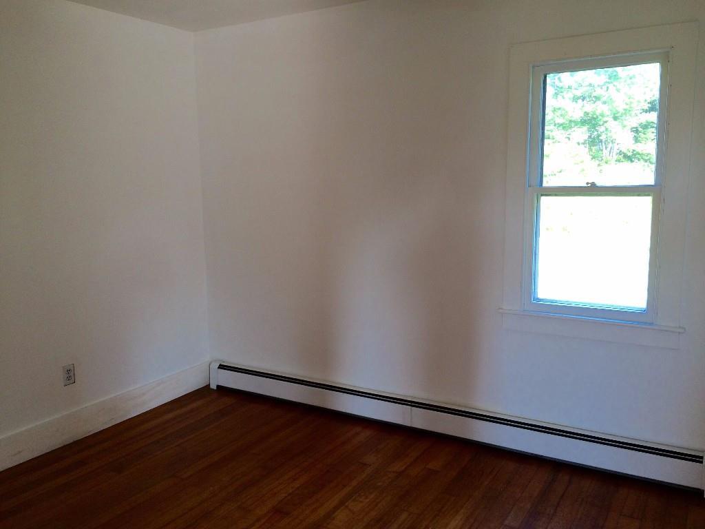 143 Tremont Road Bass Harbor, ME 04653 - Photo 13 of 29 This first floor room with wood...