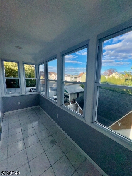 131 Bellevue Street Elizabeth, NJ 07202 - Photo 14 of 16 wooden floor in an empty room with a fireplace
