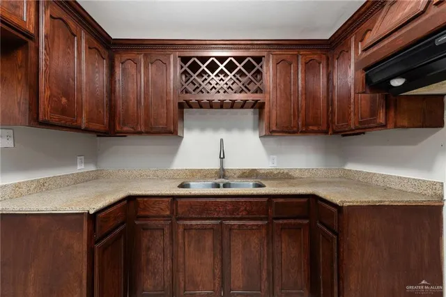 a kitchen with a sink and cabinets