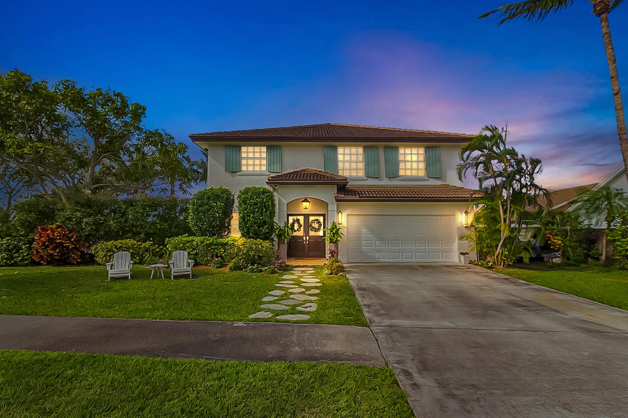 6031 Robinson Street Jupiter, FL 33458 - Photo 1 of 44 NewDusk_2040x1360-6031_Robinson_St-ThuJa