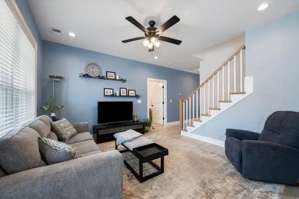 a kitchen with stainless steel appliances granite countertop a sink a stove and cabinets