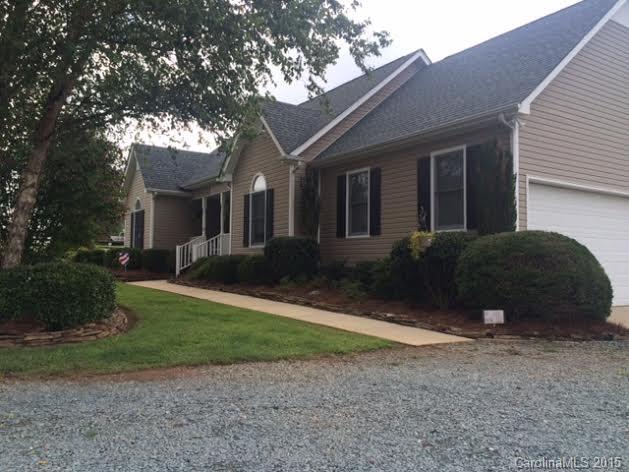 6106 Olive Branch Road Wingate, NC 28174 - Photo 2 of 19 a view of a house with backyard and trees