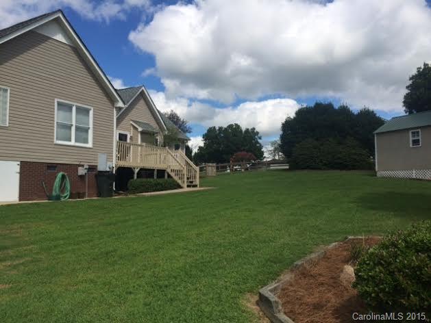6106 Olive Branch Road Wingate, NC 28174 - Photo 17 of 19 a front view of a house with a garden