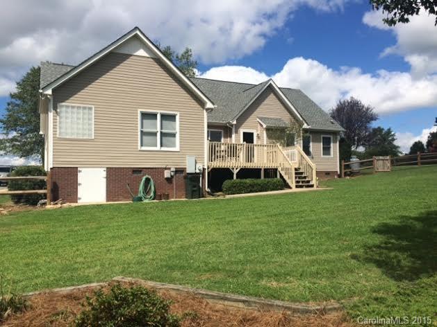 6106 Olive Branch Road Wingate, NC 28174 - Photo 18 of 19 a front view of house with yard and green space