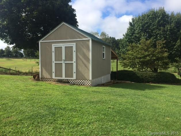 6106 Olive Branch Road Wingate, NC 28174 - Photo 19 of 19 a front view of a house with garden