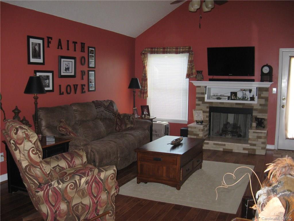 6106 Olive Branch Road Wingate, NC 28174 - Photo 3 of 19 a living room with furniture and a flat screen tv
