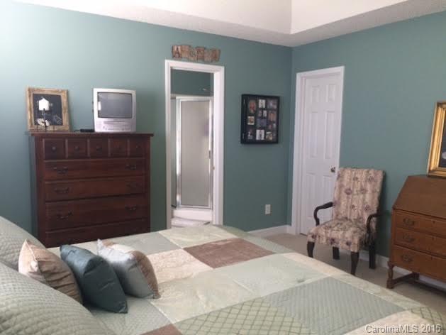 6106 Olive Branch Road Wingate, NC 28174 - Photo 10 of 19 a bedroom with a bed and dresser