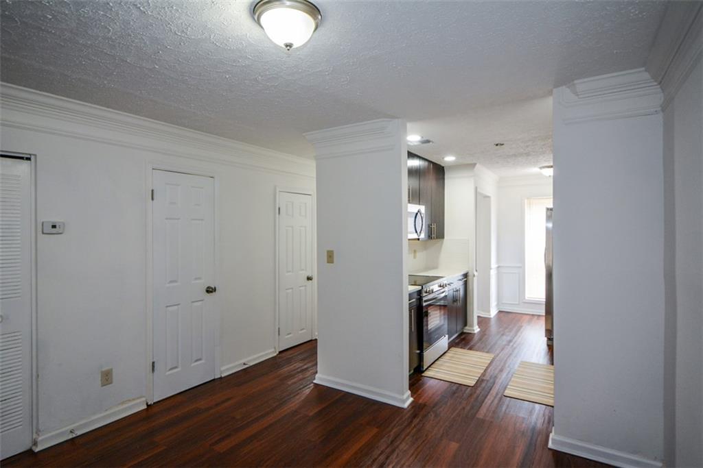 2340 Beaver Ruin Road, Unit UN26 Norcross, GA 30071 - Photo 16 of 42 a view of a livingroom with wooden floor
