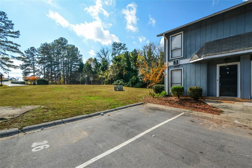 2340 Beaver Ruin Road, Unit UN26 Norcross, GA 30071 - Photo 2 of 42 a view of a house with a yard and potted plants