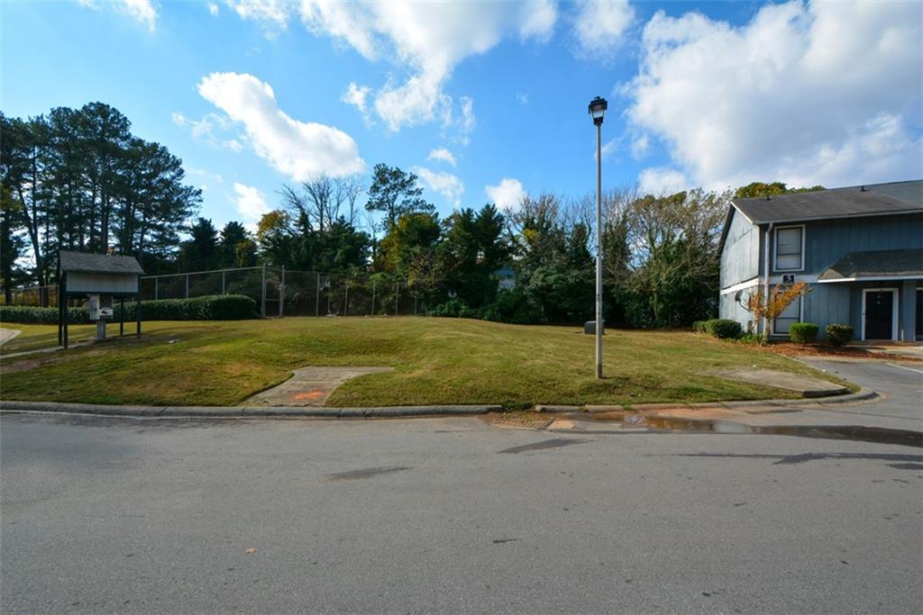 2340 Beaver Ruin Road, Unit UN26 Norcross, GA 30071 - Photo 3 of 42 a view of a house with a yard