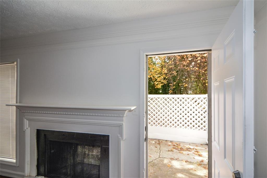 2340 Beaver Ruin Road, Unit UN26 Norcross, GA 30071 - Photo 40 of 42 a view of a livingroom with a fireplace