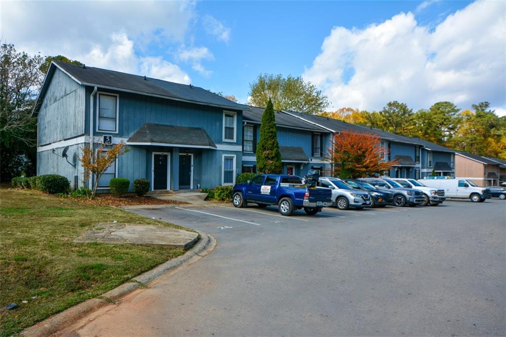 2340 Beaver Ruin Road, Unit UN26 Norcross, GA 30071 - Photo 4 of 42 a view of a car park in front of house
