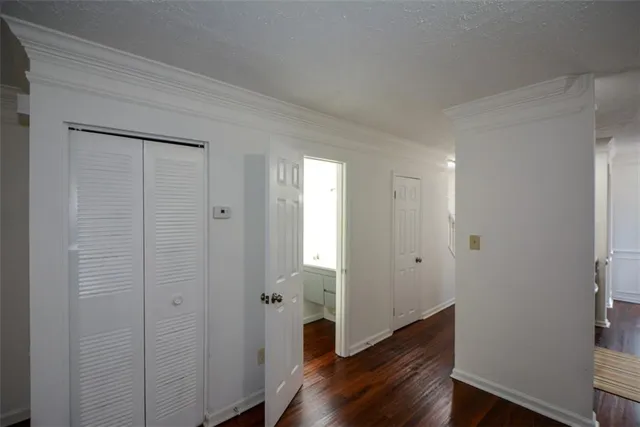 a area with wooden floor and window