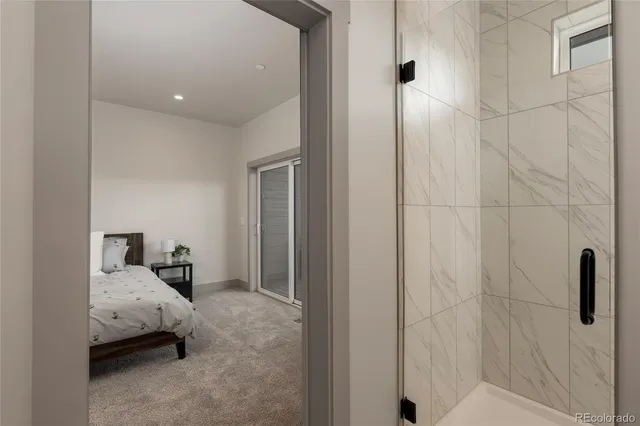 a bed room with a bed and a window