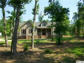 481 Rutledge Drive Catawba, SC 29704 - Photo 1 of 8 a front view of a house with a garden
