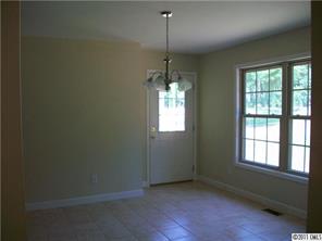 481 Rutledge Drive Catawba, SC 29704 - Photo 3 of 8 an empty room with windows and entrance
