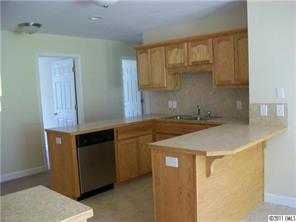481 Rutledge Drive Catawba, SC 29704 - Photo 4 of 8 a kitchen with stainless steel appliances granite countertop a sink and a stove