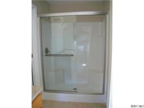 481 Rutledge Drive Catawba, SC 29704 - Photo 7 of 8 a bathroom with a glass shower door