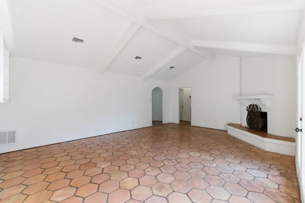 a view of a room with a fireplace