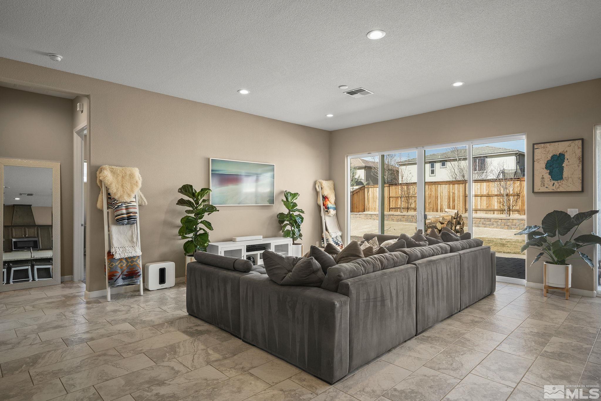 2895 Ethelinda Way Reno, NV 89521 - Photo 4 of 30 a living room with furniture and large windows
