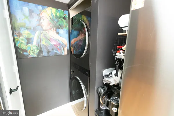 a kitchen with granite countertop a sink and a stove