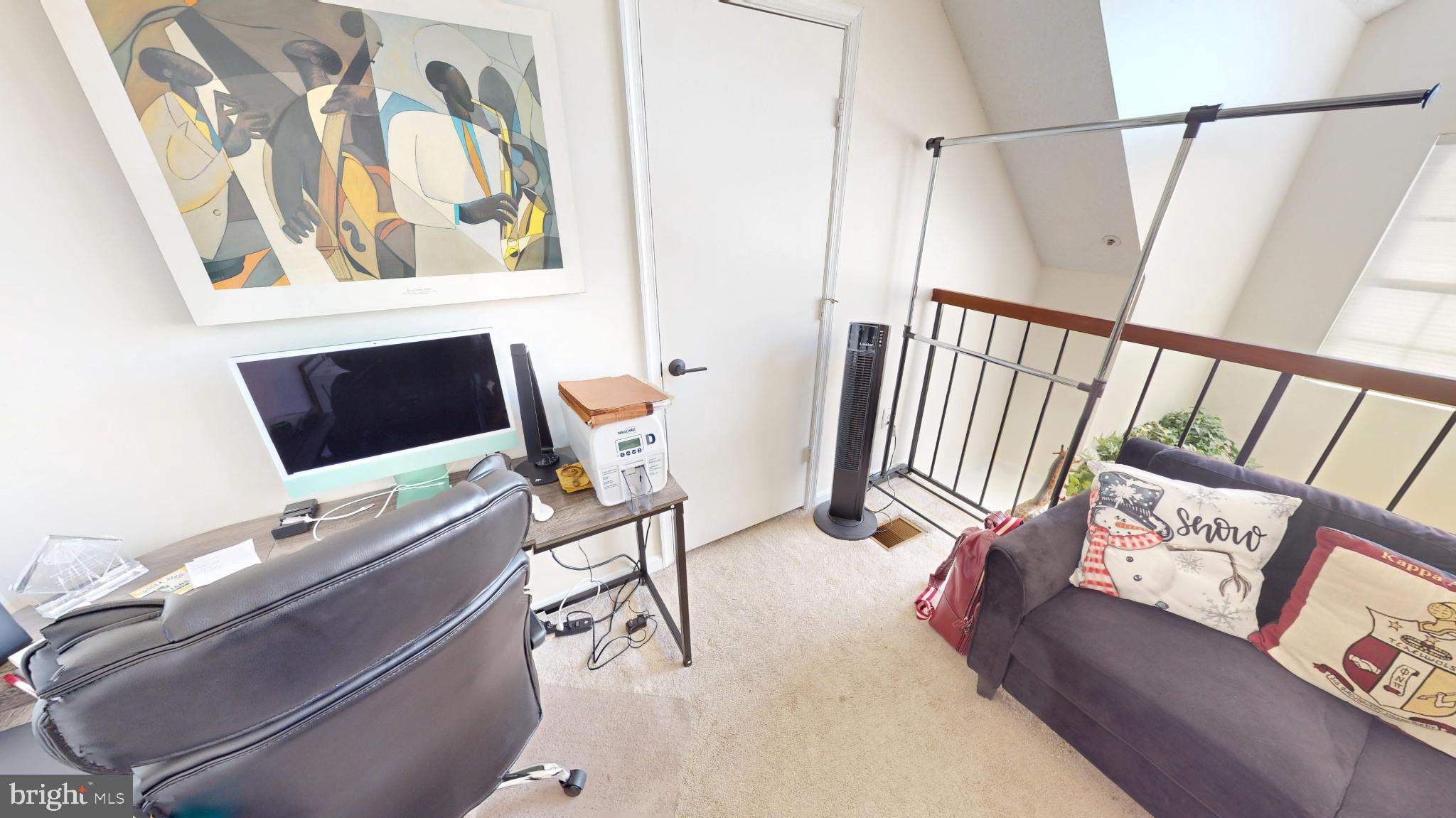 14111 Yardarm Way, Unit 1209 Laurel, MD 20707 - Photo 26 of 29 a living room with furniture and a flat screen tv