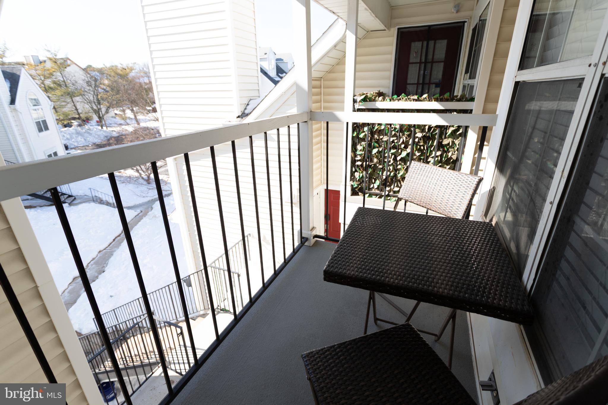 14111 Yardarm Way, Unit 1209 Laurel, MD 20707 - Photo 28 of 29 a view of a balcony with furniture and a gate