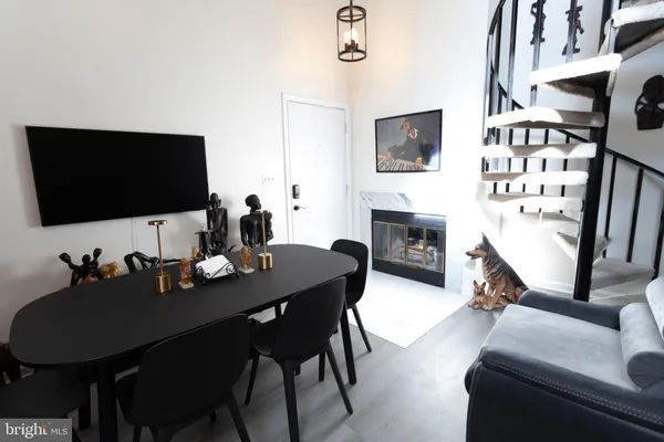 a living room with furniture flat screen tv and a fireplace