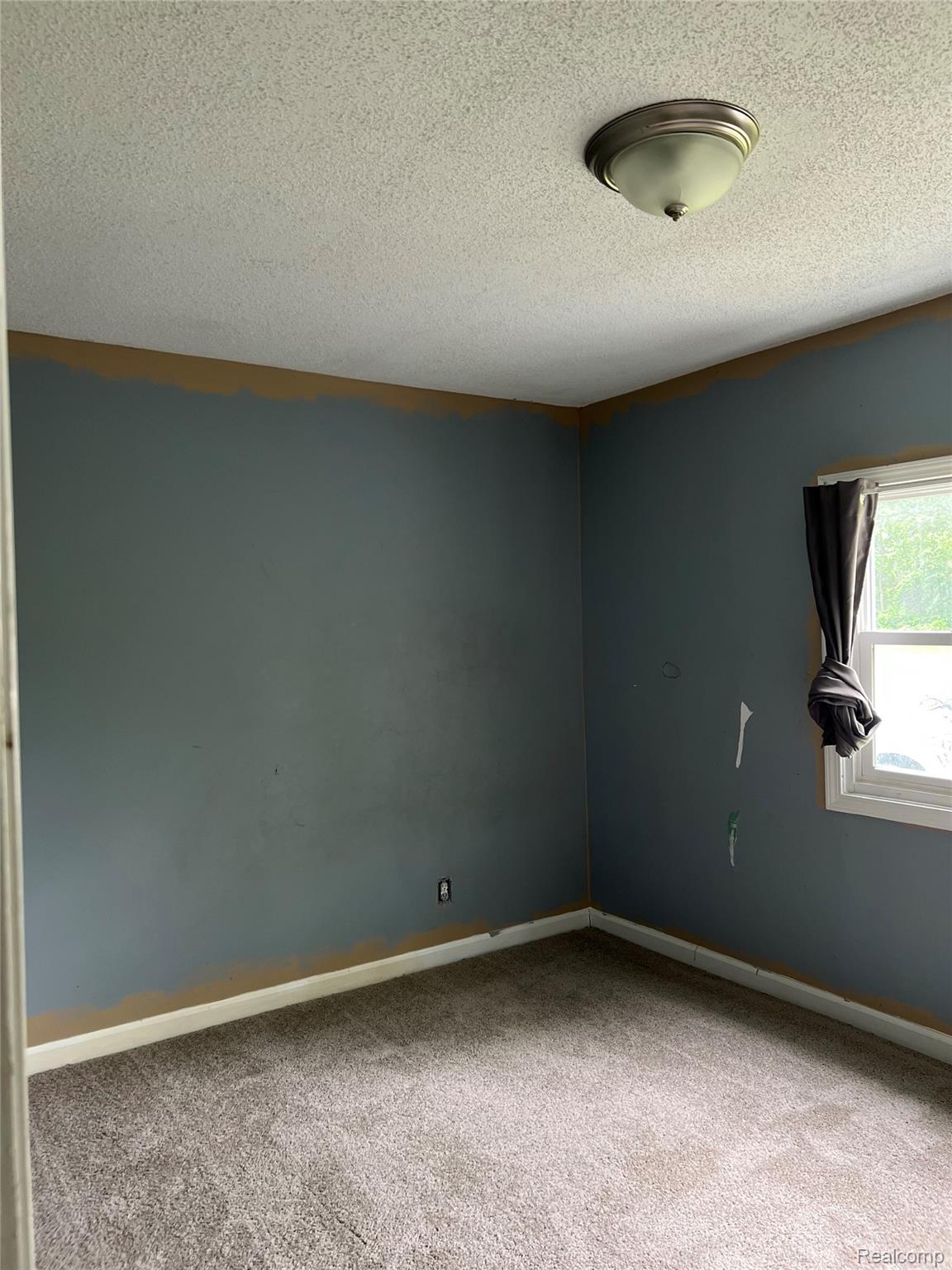 35945 Herman Street Romulus, MI 48174 - Photo 18 of 26 Spare room with a textured ceiling and carpet floors