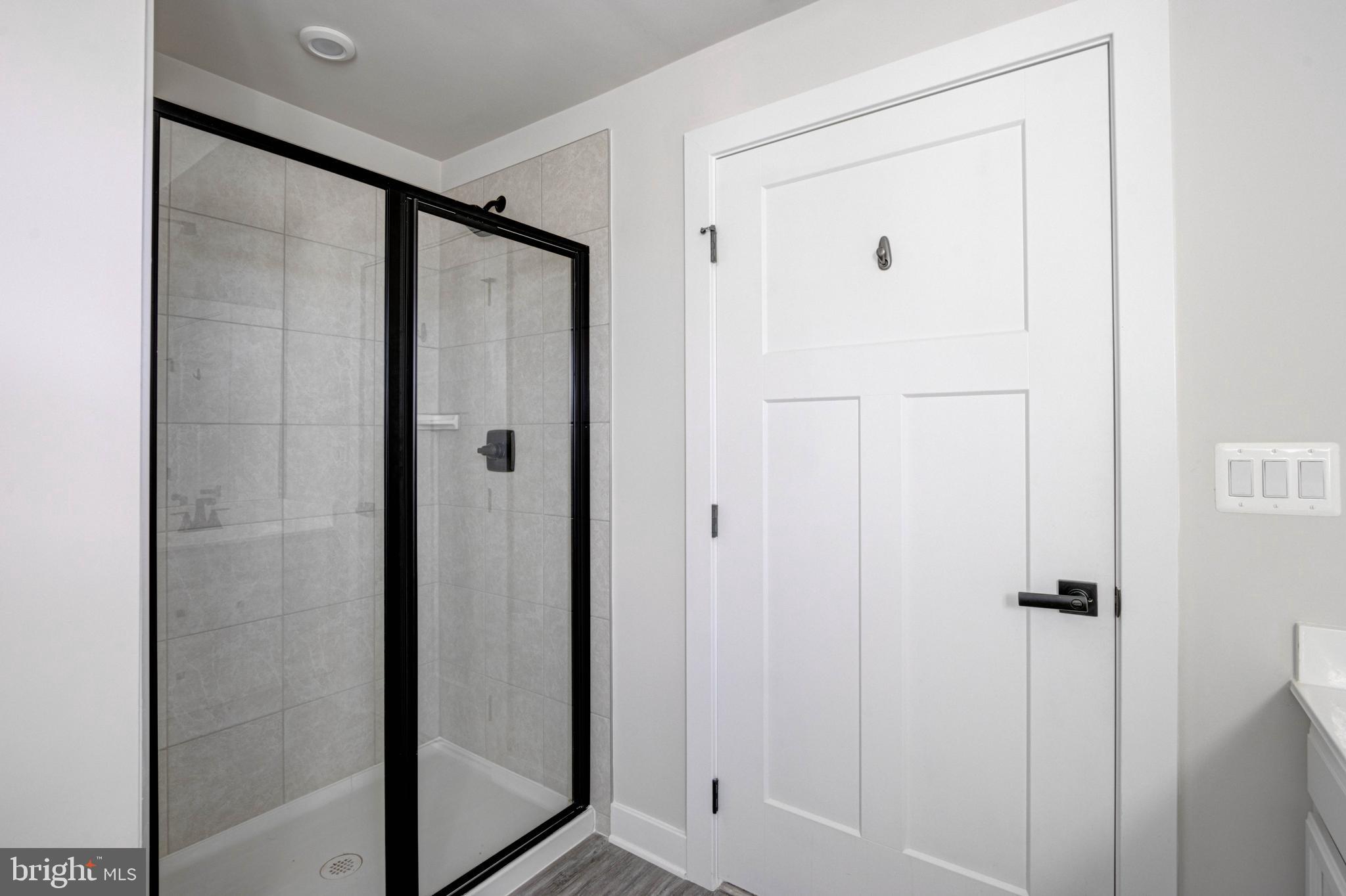 3282 Pine Needle Circle, Unit 403 Frederick, MD 21704 - Photo 24 of 49 Primary bathroom with ceramic tile back splash