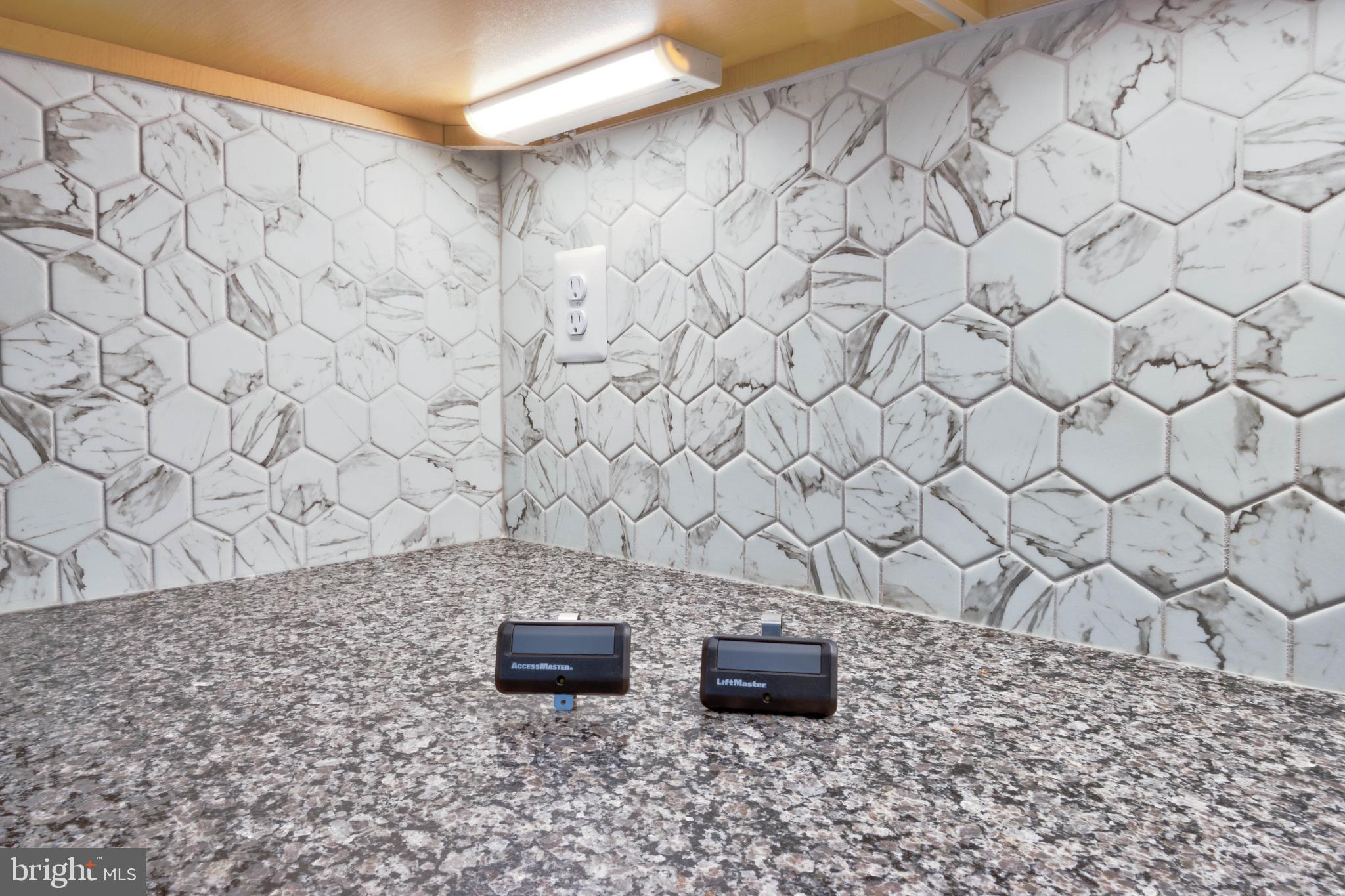 3282 Pine Needle Circle, Unit 403 Frederick, MD 21704 - Photo 35 of 49 Two remote garage remote controls convey