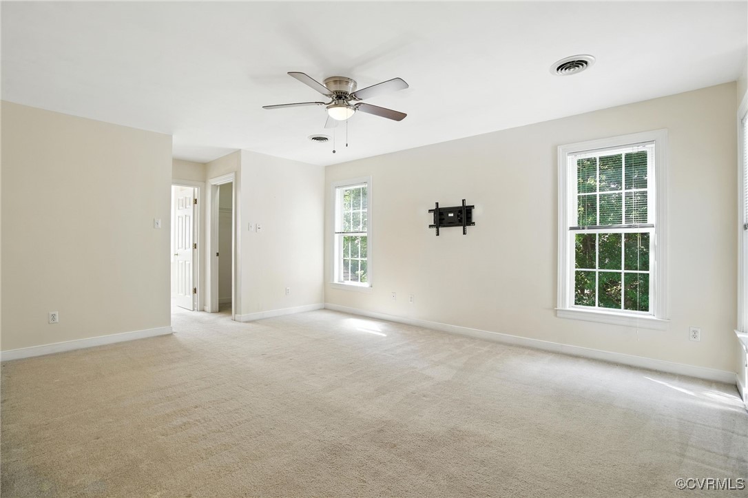 8248 Hampton Arbor Circle Chesterfield, VA 23832 - Photo 15 of 41 an empty room with windows and fan chandelier