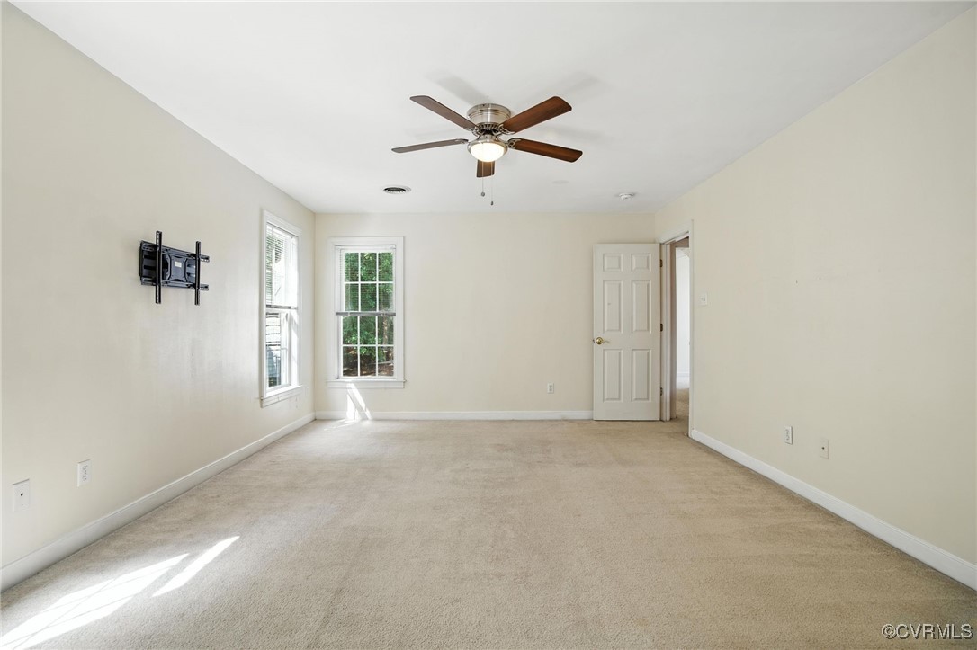 8248 Hampton Arbor Circle Chesterfield, VA 23832 - Photo 16 of 41 a view of a livingroom with a ceiling fan and window