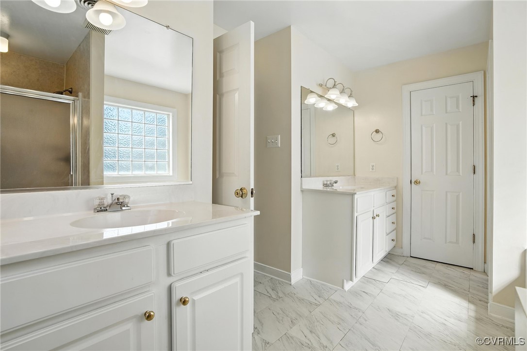 8248 Hampton Arbor Circle Chesterfield, VA 23832 - Photo 19 of 41 a bathroom with a double vanity sink mirror and next to a window