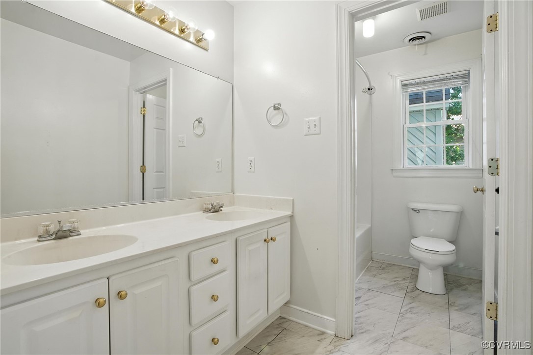 8248 Hampton Arbor Circle Chesterfield, VA 23832 - Photo 22 of 41 a bathroom with a granite countertop sink a toilet and a mirror