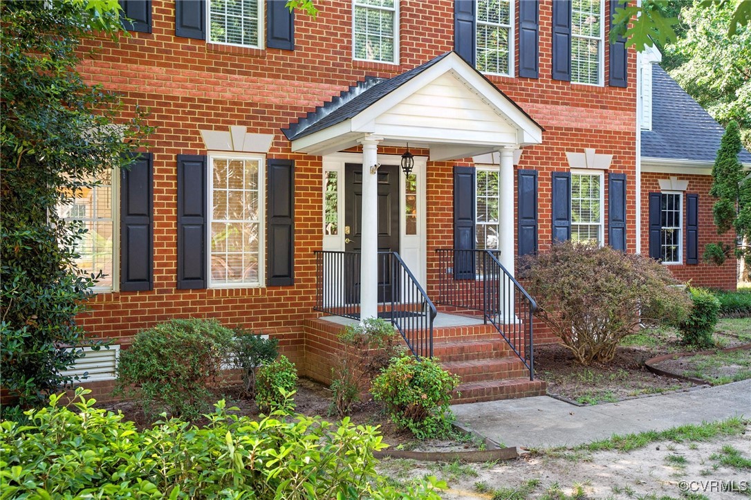8248 Hampton Arbor Circle Chesterfield, VA 23832 - Photo 40 of 41 a front view of a house with garden