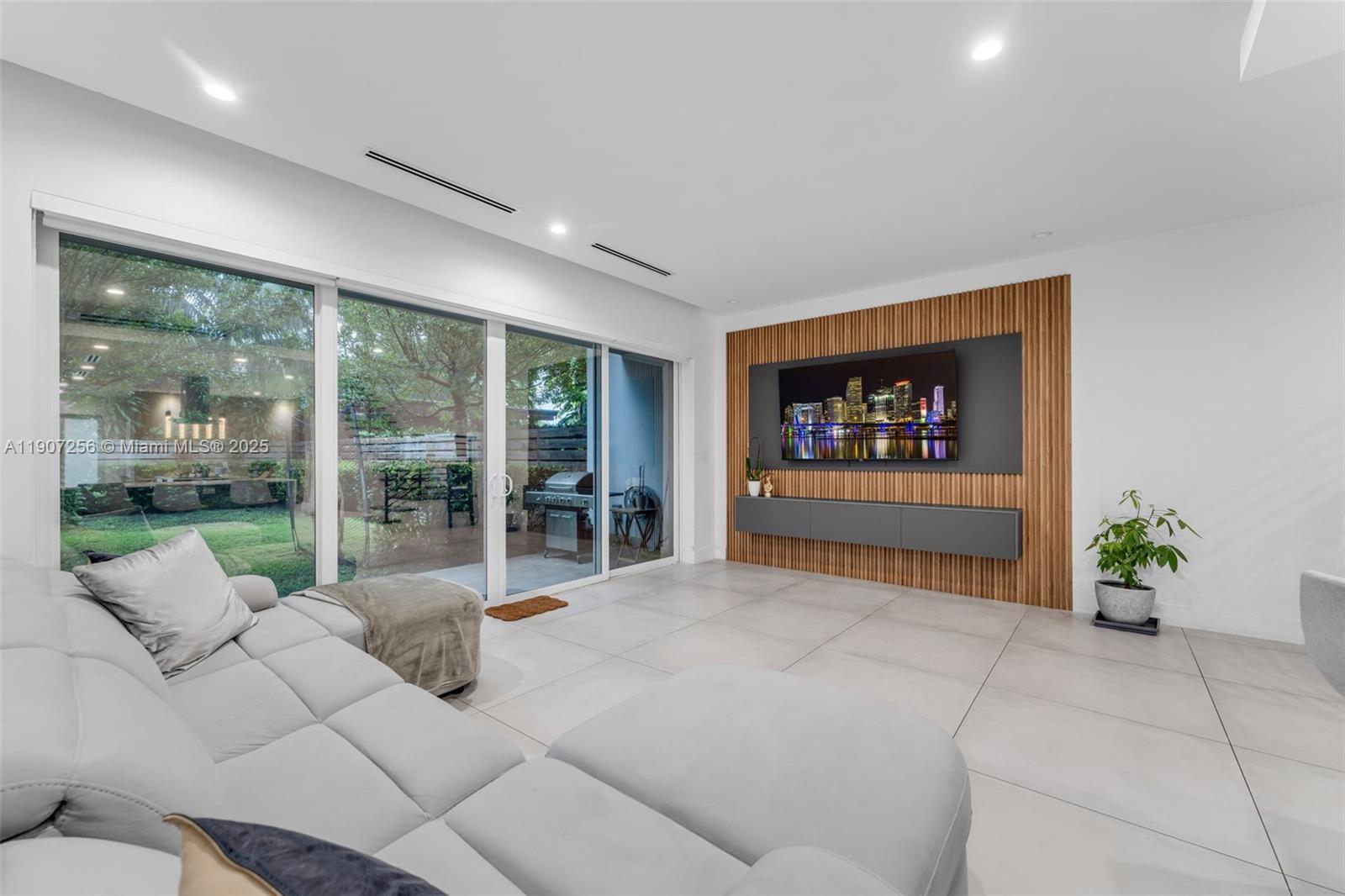 3048 Southwest 18th Street, Unit 3048 Miami, FL 33145 - Photo 11 of 39 a living room with furniture and a flat screen tv