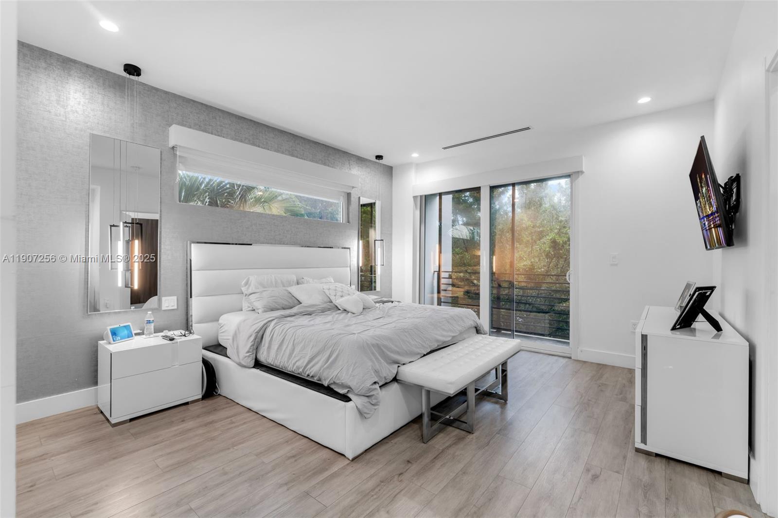 3048 Southwest 18th Street, Unit 3048 Miami, FL 33145 - Photo 15 of 39 a bedroom with a bed and large window