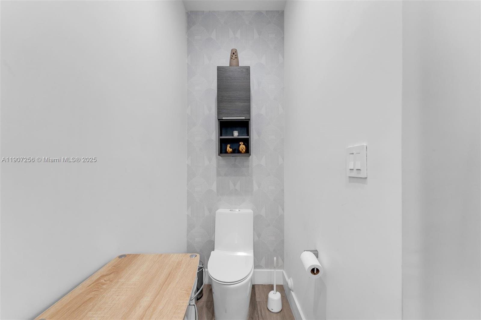 3048 Southwest 18th Street, Unit 3048 Miami, FL 33145 - Photo 19 of 39 a bathroom with a toilet and a vanity