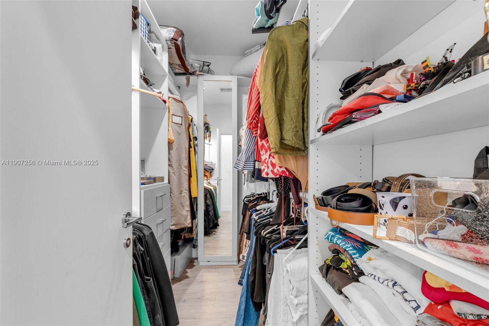 3048 Southwest 18th Street, Unit 3048 Miami, FL 33145 - Photo 20 of 39 a view of walk in closet with clothes and shoes