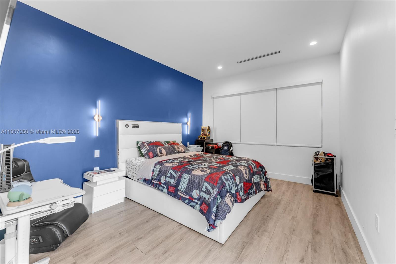 3048 Southwest 18th Street, Unit 3048 Miami, FL 33145 - Photo 23 of 39 a bedroom with a bed and a lamp