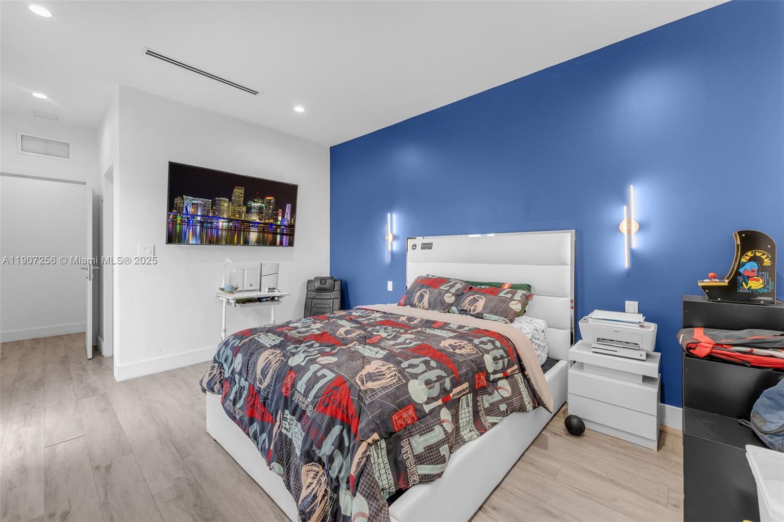 3048 Southwest 18th Street, Unit 3048 Miami, FL 33145 - Photo 24 of 39 a bedroom with a bed and a flat screen tv