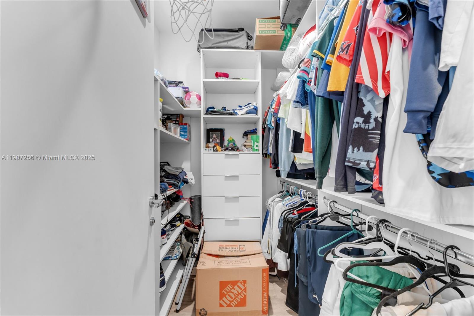 3048 Southwest 18th Street, Unit 3048 Miami, FL 33145 - Photo 27 of 39 a view of walk in closet with clothes and shoes