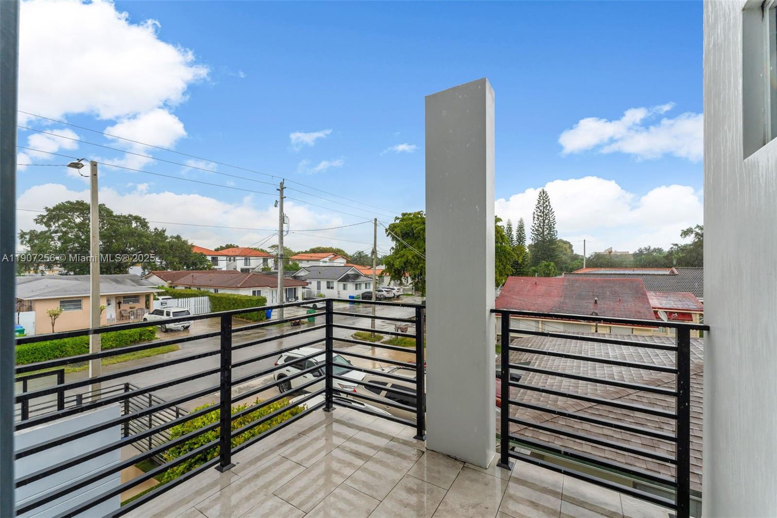 3048 Southwest 18th Street, Unit 3048 Miami, FL 33145 - Photo 28 of 39 a view of a balcony with wooden floor