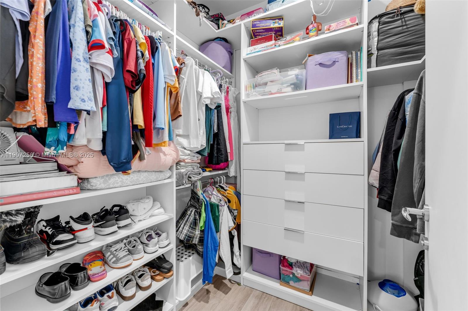 3048 Southwest 18th Street, Unit 3048 Miami, FL 33145 - Photo 32 of 39 a view of walk in closet with clothes and shoes